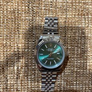 Rolex Silver Watch with Green Dial